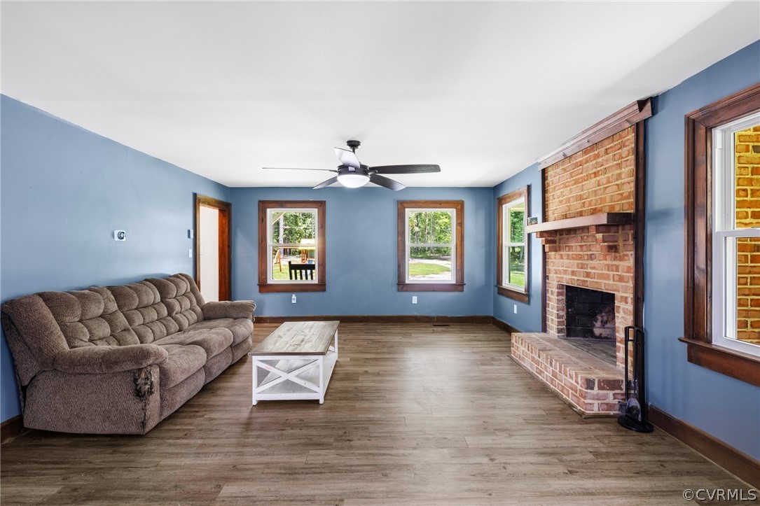 6621 Cox Road Wilsons, VA 23894 - Photo 11 of 44 a living room with furniture and a fireplace