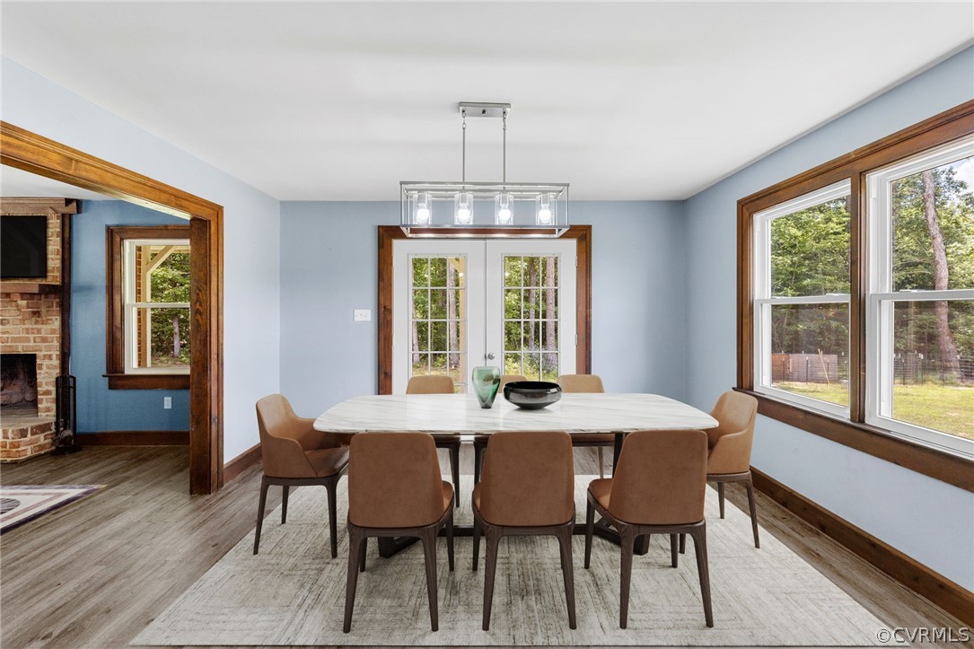6621 Cox Road Wilsons, VA 23894 - Photo 14 of 44 a view of a dining room with furniture window and wooden floor