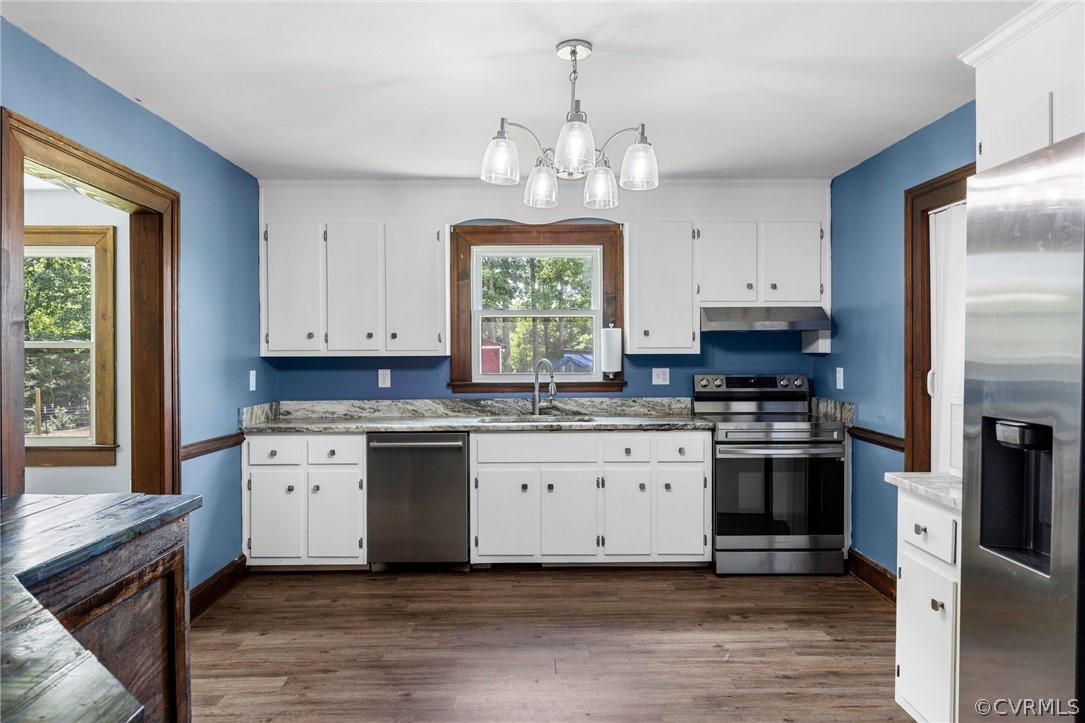 6621 Cox Road Wilsons, VA 23894 - Photo 16 of 44 a kitchen with a stove a sink and a refrigerator