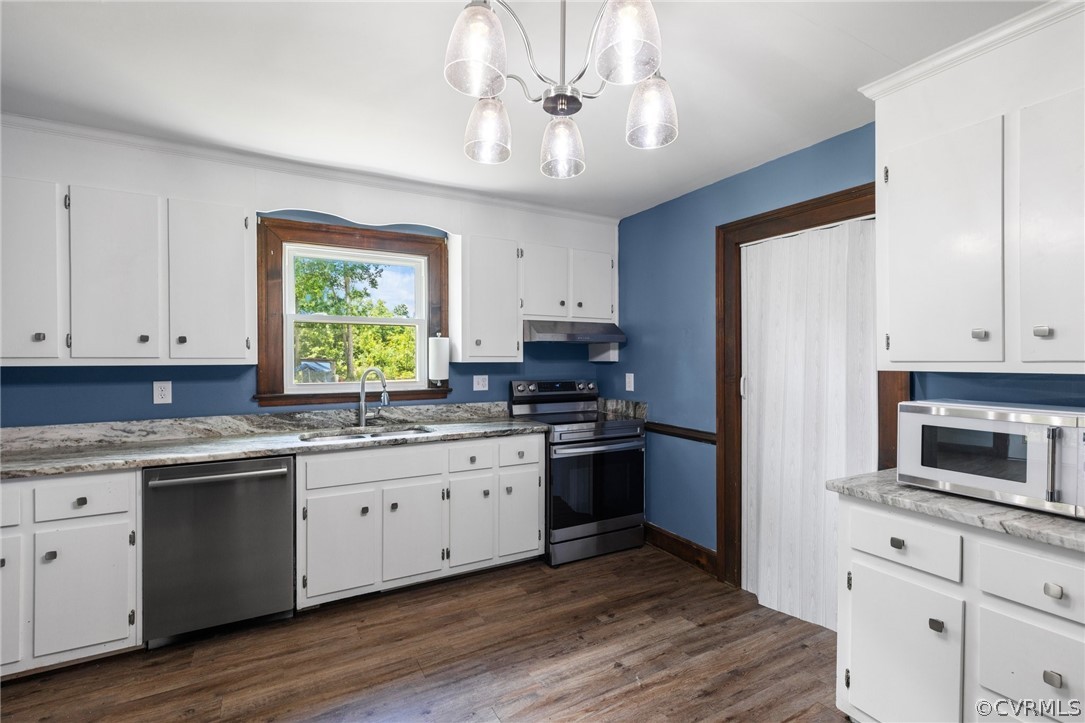 6621 Cox Road Wilsons, VA 23894 - Photo 17 of 44 a kitchen with granite countertop cabinets stainless steel appliances a sink and a window