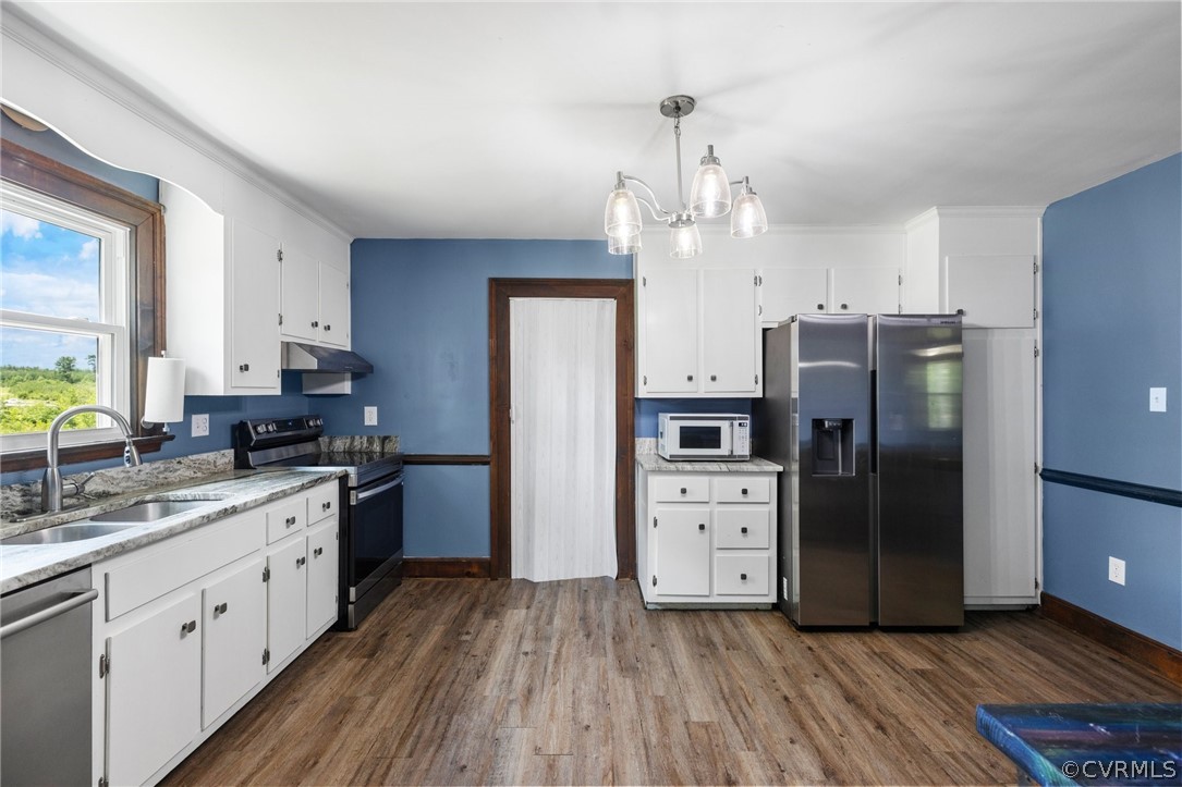 6621 Cox Road Wilsons, VA 23894 - Photo 18 of 44 a kitchen with stainless steel appliances a refrigerator sink and stove