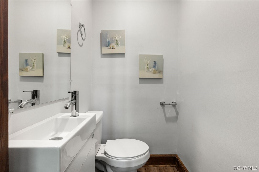 6621 Cox Road Wilsons, VA 23894 - Photo 20 of 44 a bathroom with a sink mirror and toilet