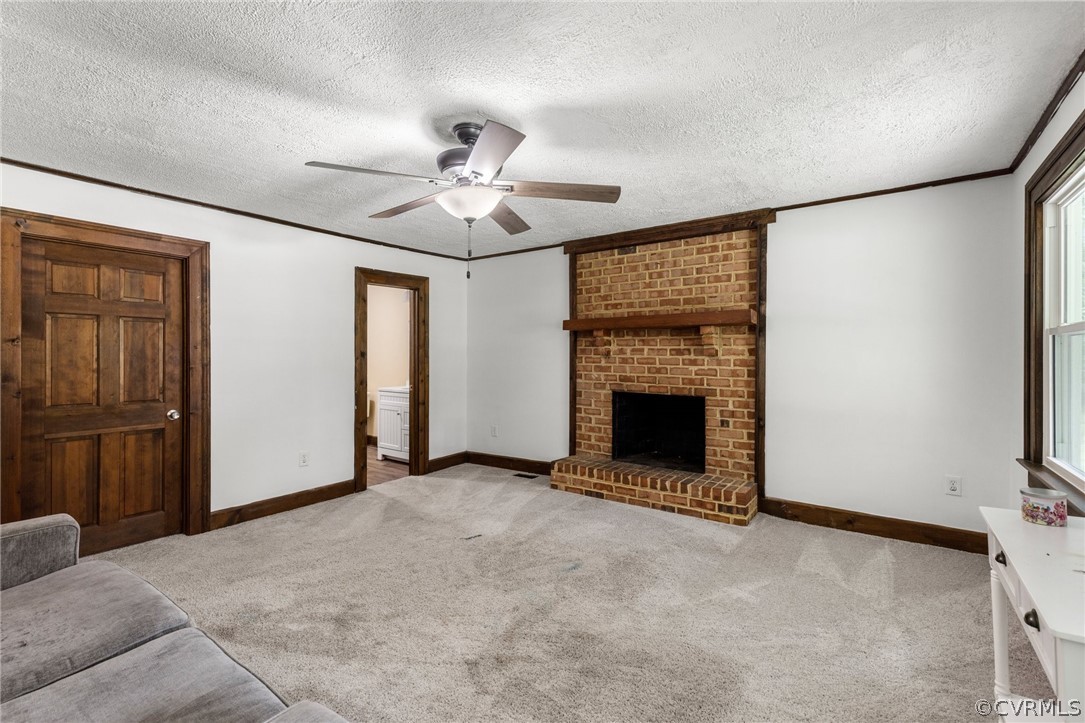6621 Cox Road Wilsons, VA 23894 - Photo 22 of 44 a view of an empty room with a fireplace