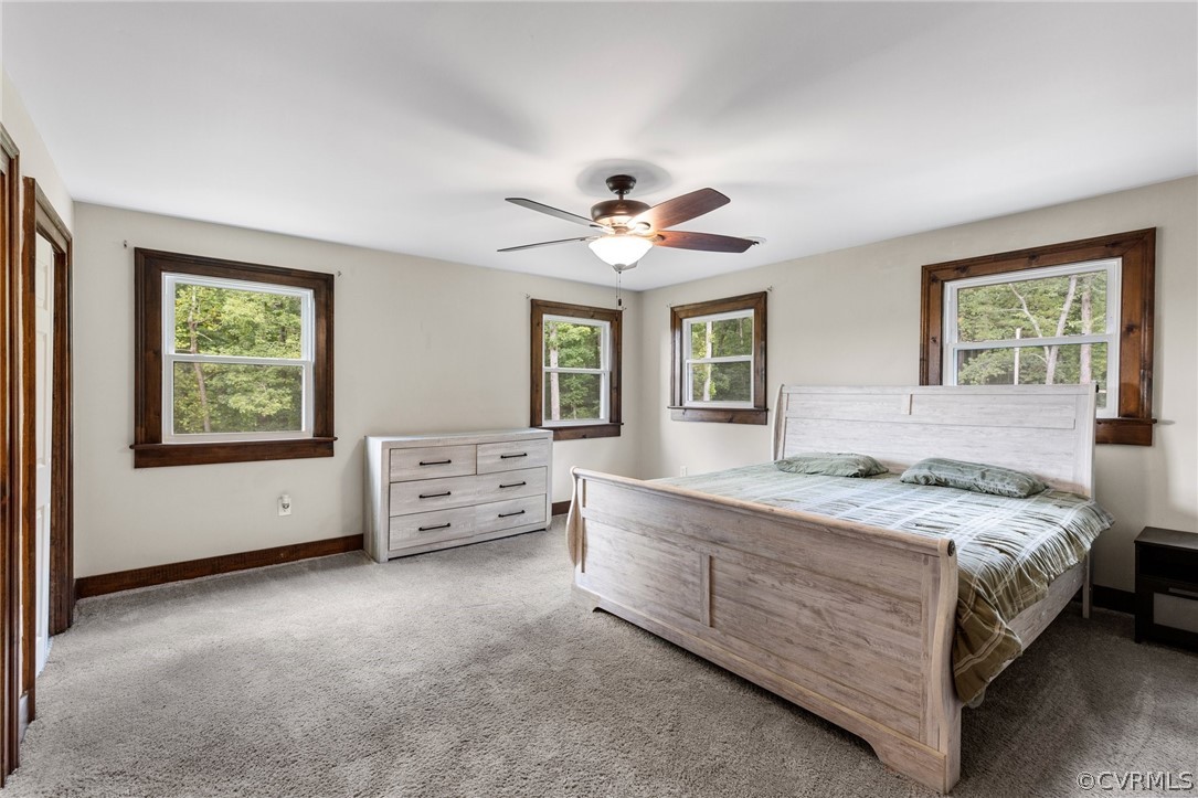 6621 Cox Road Wilsons, VA 23894 - Photo 25 of 44 a bedroom with a bed and a large window