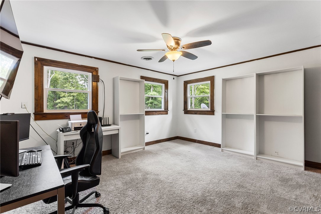 6621 Cox Road Wilsons, VA 23894 - Photo 30 of 44 a view of a workspace with furniture and a window