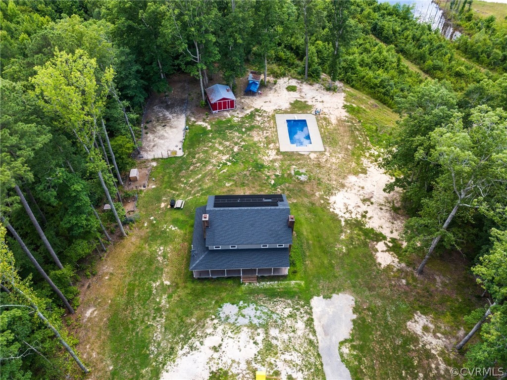 6621 Cox Road Wilsons, VA 23894 - Photo 3 of 44 a backyard of a house with a yard and outdoor seating