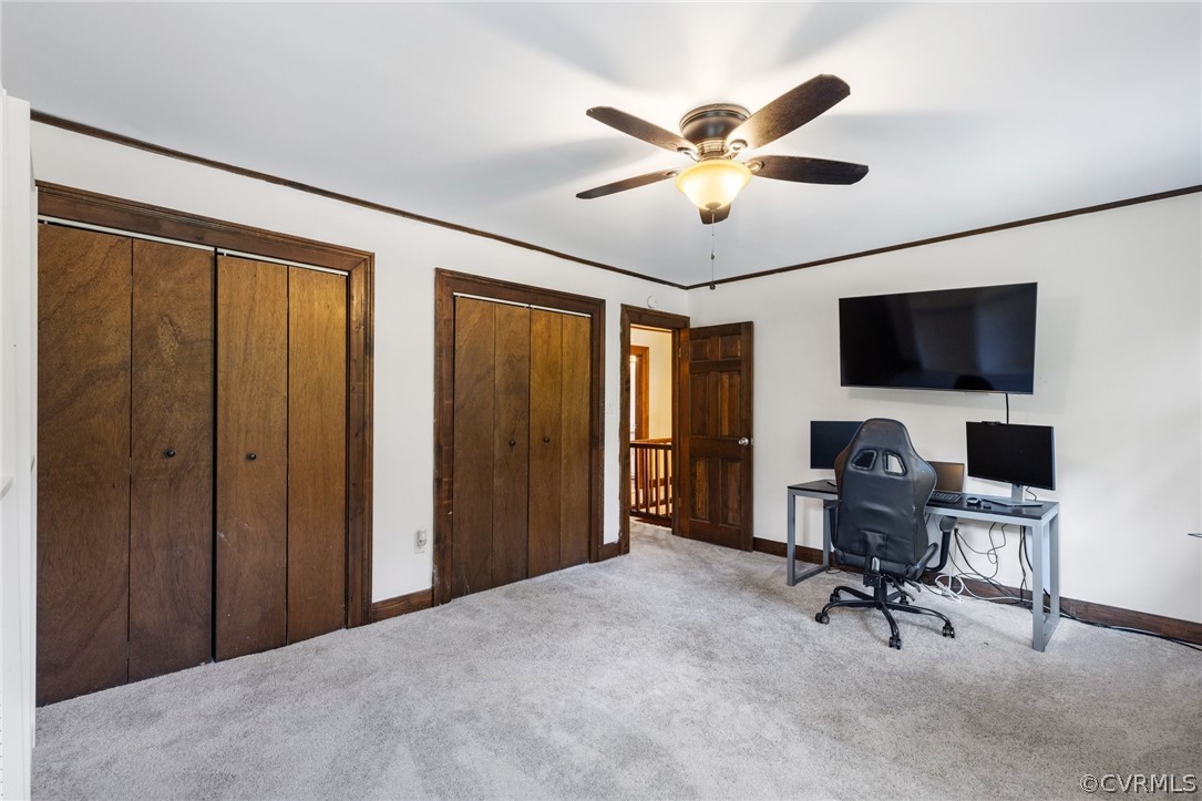 6621 Cox Road Wilsons, VA 23894 - Photo 31 of 44 a view of a livingroom with a flat screen tv and a ceiling fan