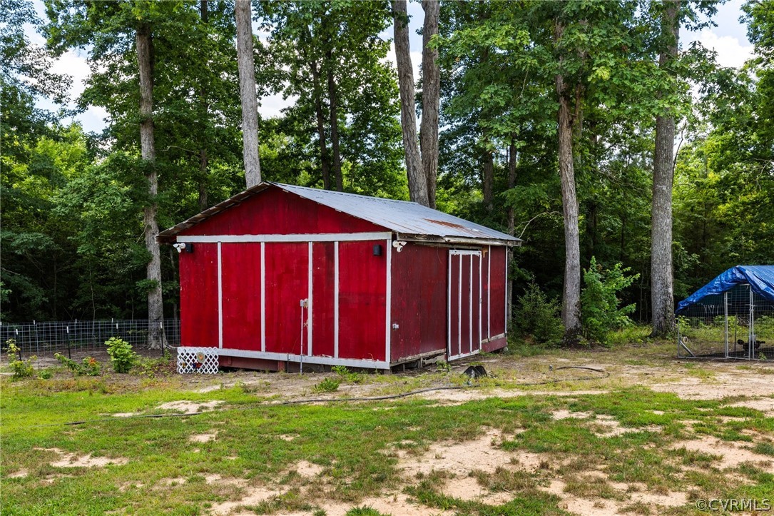 6621 Cox Road Wilsons, VA 23894 - Photo 34 of 44 a view of backyard of house with green space