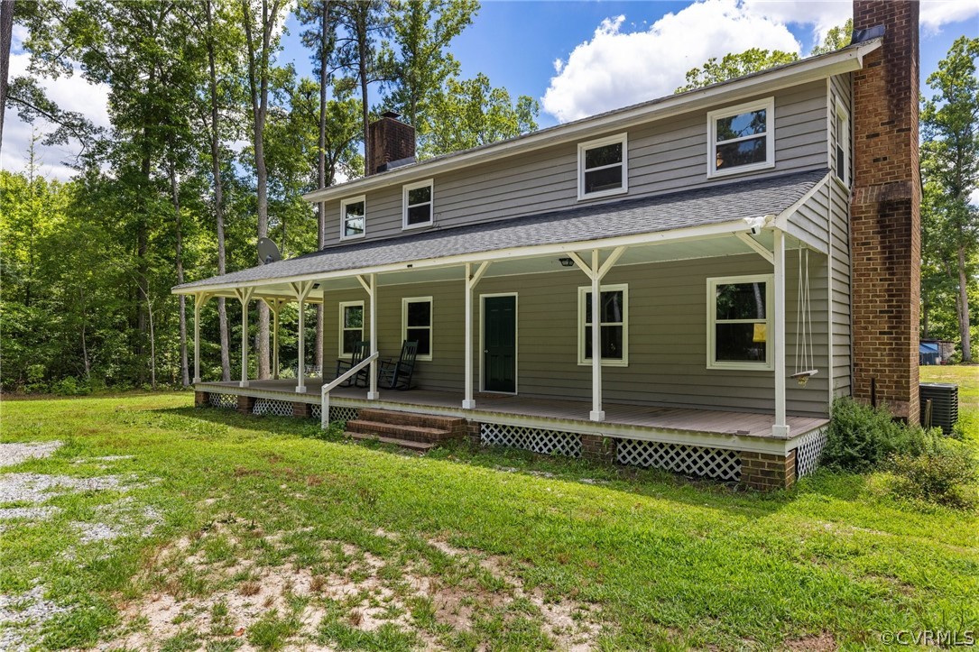 6621 Cox Road Wilsons, VA 23894 - Photo 4 of 44 a view of a house with backyard and porch