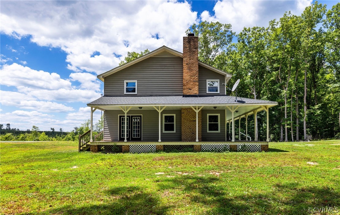 6621 Cox Road Wilsons, VA 23894 - Photo 6 of 44 a view of a house with a garden