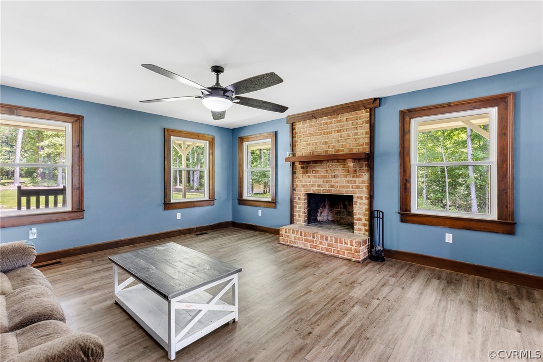 6621 Cox Road Wilsons, VA 23894 - Photo 10 of 44 a living room with furniture and a fireplace