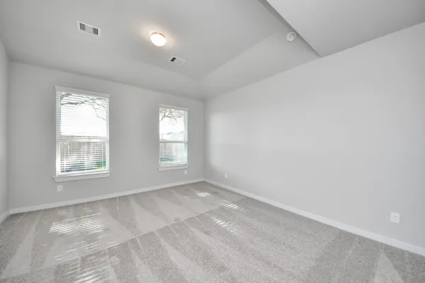 an empty room with closet area