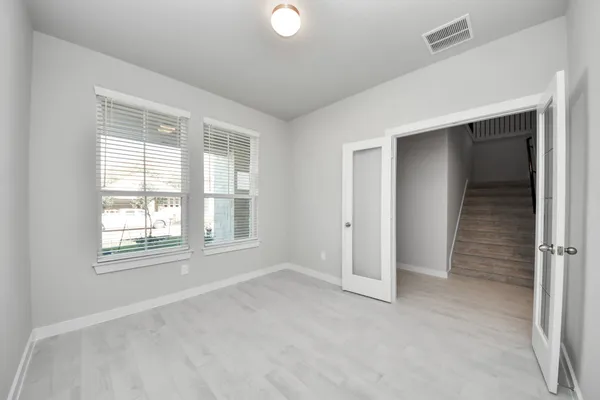 a large kitchen with kitchen island a sink a center island stainless steel appliances and a cabinets