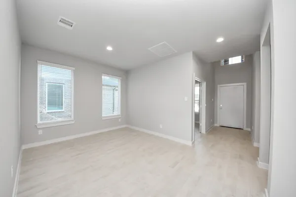 a kitchen with a sink a stove and cabinets