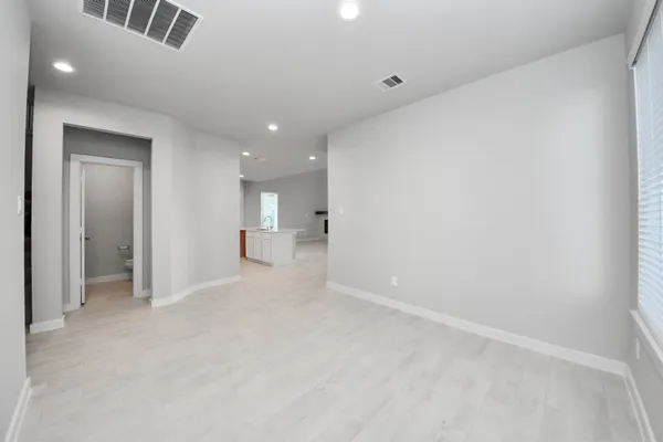 a large kitchen with kitchen island a sink stainless steel appliances and cabinets