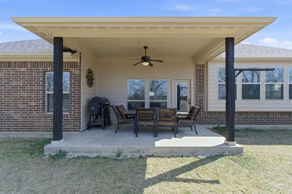711 Hadley Lane Valley View, TX 76272 - Photo 27 of 40 View of patio / terrace with ceiling fan and a grill