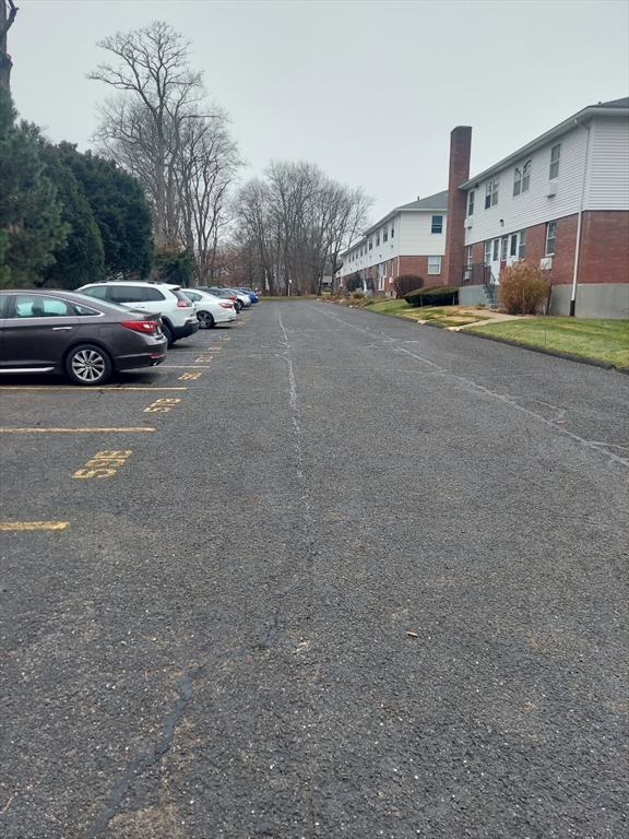 57 Colonial Circle, Unit D Chicopee, MA 01020 - Photo 4 of 19 a view of street with parked cars