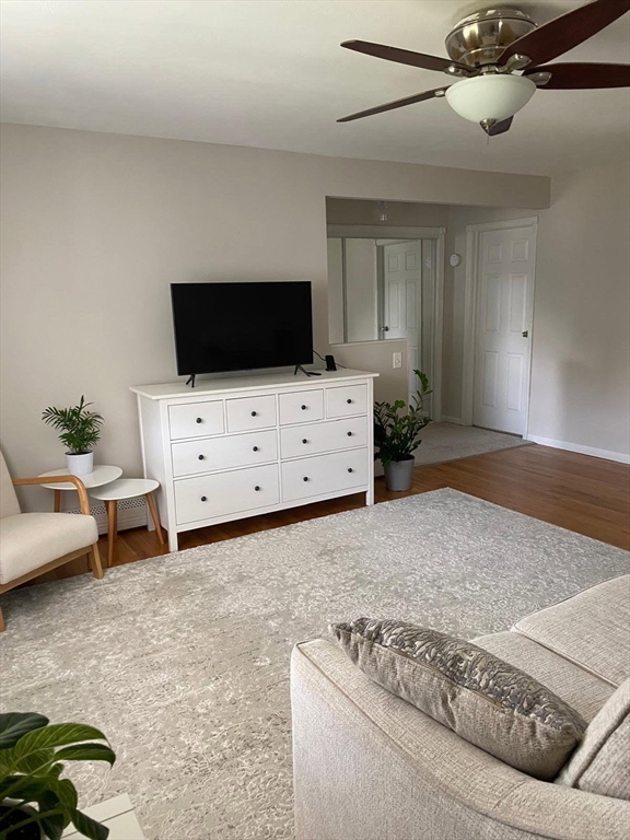 57 Colonial Circle, Unit D Chicopee, MA 01020 - Photo 10 of 19 a living room with furniture and a flat screen tv