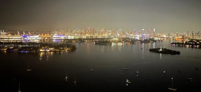 a view of water with boats and trees