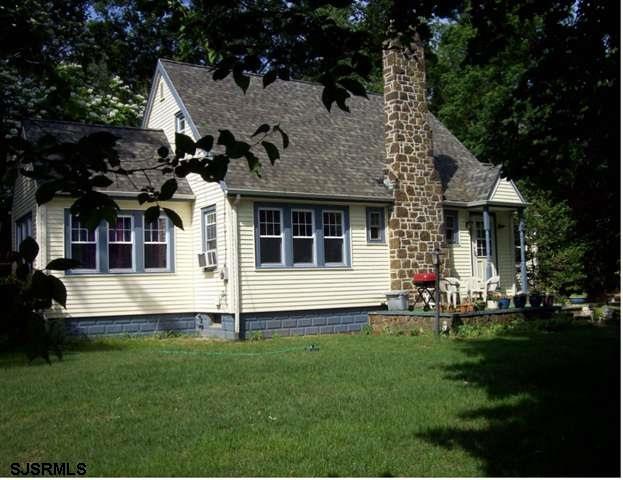 3691 Harding Highway Malaga, NJ 08328 - Photo 1 of 1 a front view of house with yard and outdoor seating