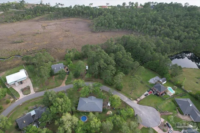 an aerial view of a house with outdoor space