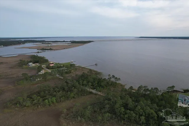 an aerial view of ocean with beach