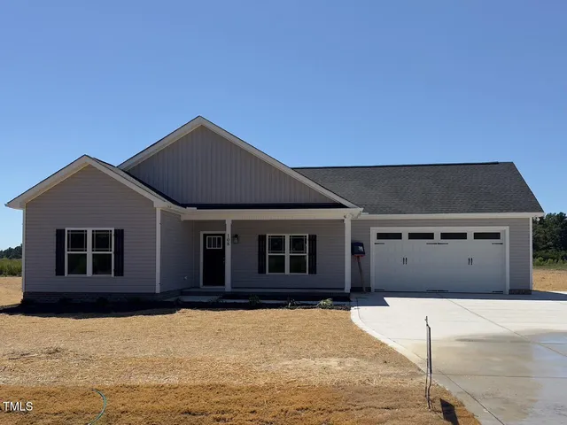 a house with trees in the background