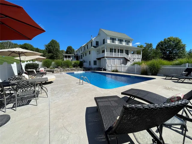 a view of a patio with swimming pool