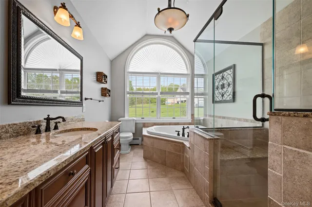 a large kitchen with stainless steel appliances a sink and a large window