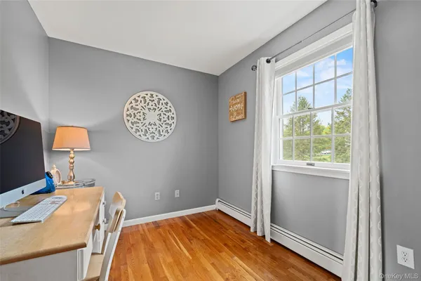 a large kitchen with stainless steel appliances a sink and a large window