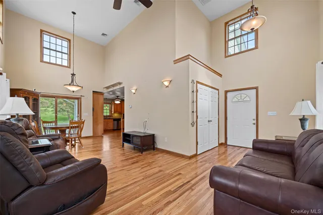 a kitchen with stainless steel appliances granite countertop a stove and a wooden floors