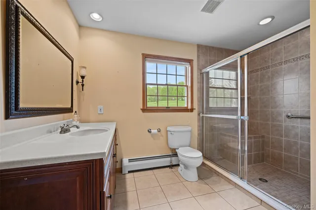 a view of a house with backyard and a garden