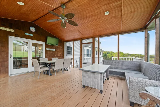 a view of a swimming pool with sitting area