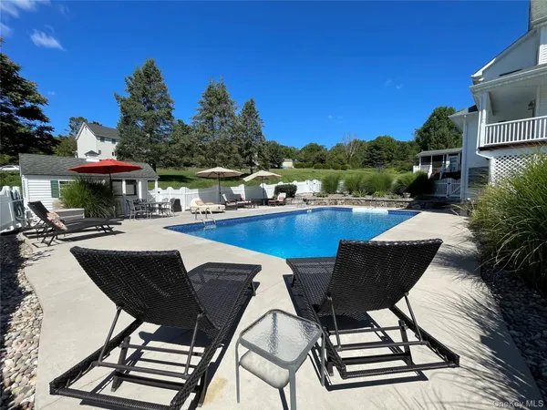 a view of a garden with sitting area