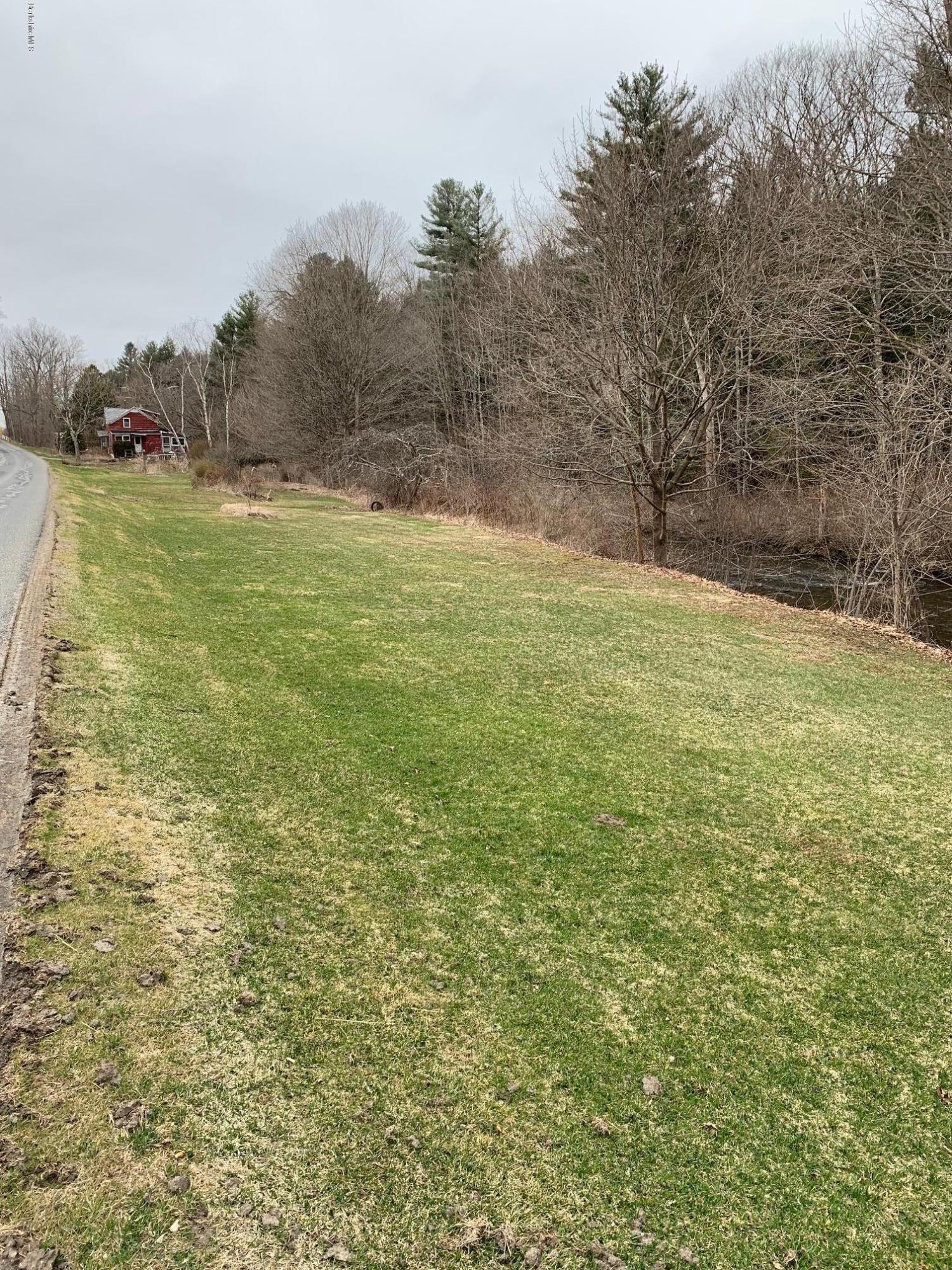 135 Main Road Tyringham, MA 01264 - Photo 8 of 8 a view of a field with an trees