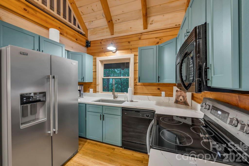 192 Dewitt Barnett Road, Unit 2 Vilas, NC 28692 - Photo 14 of 32 a kitchen with stainless steel appliances granite countertop a refrigerator and a stove