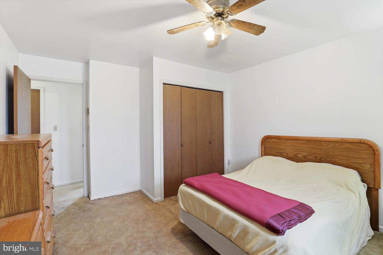 107 North Line Road Stevens, PA 17578 - Photo 12 of 26 a bedroom with a large bed and a chandelier