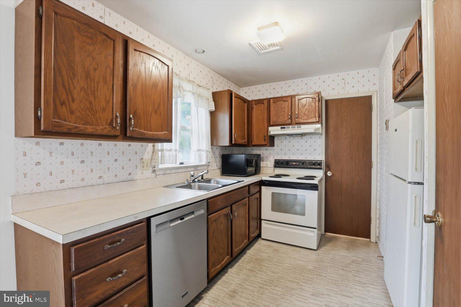 107 North Line Road Stevens, PA 17578 - Photo 5 of 26 a kitchen with a stove sink and cabinets