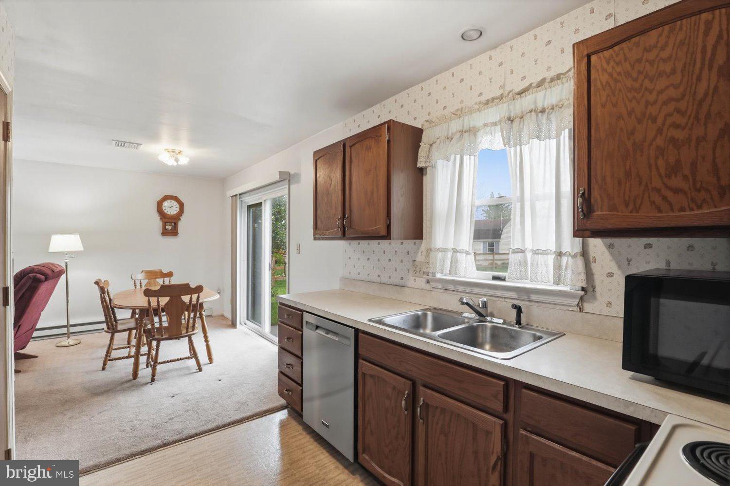 107 North Line Road Stevens, PA 17578 - Photo 7 of 26 a kitchen with a sink cabinets and appliances