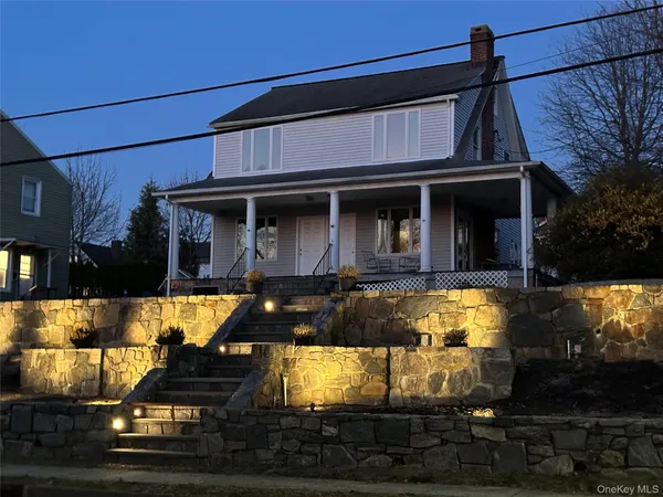 a view of a house with a yard balcony