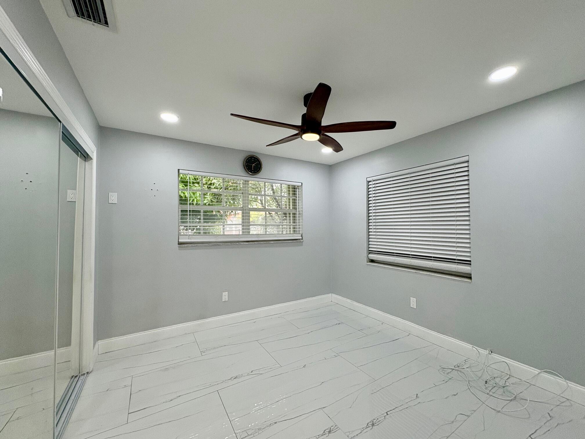 1733 Sunset Avenue Lake Worth Beach, FL 33460 - Photo 18 of 19 a view of a ceiling fan and a window