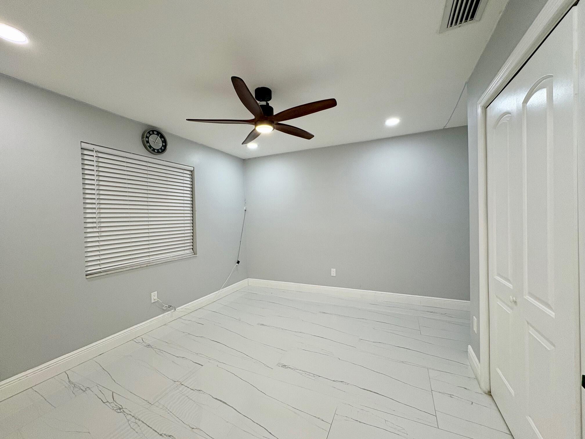 1733 Sunset Avenue Lake Worth Beach, FL 33460 - Photo 19 of 19 a view of an empty room with a window
