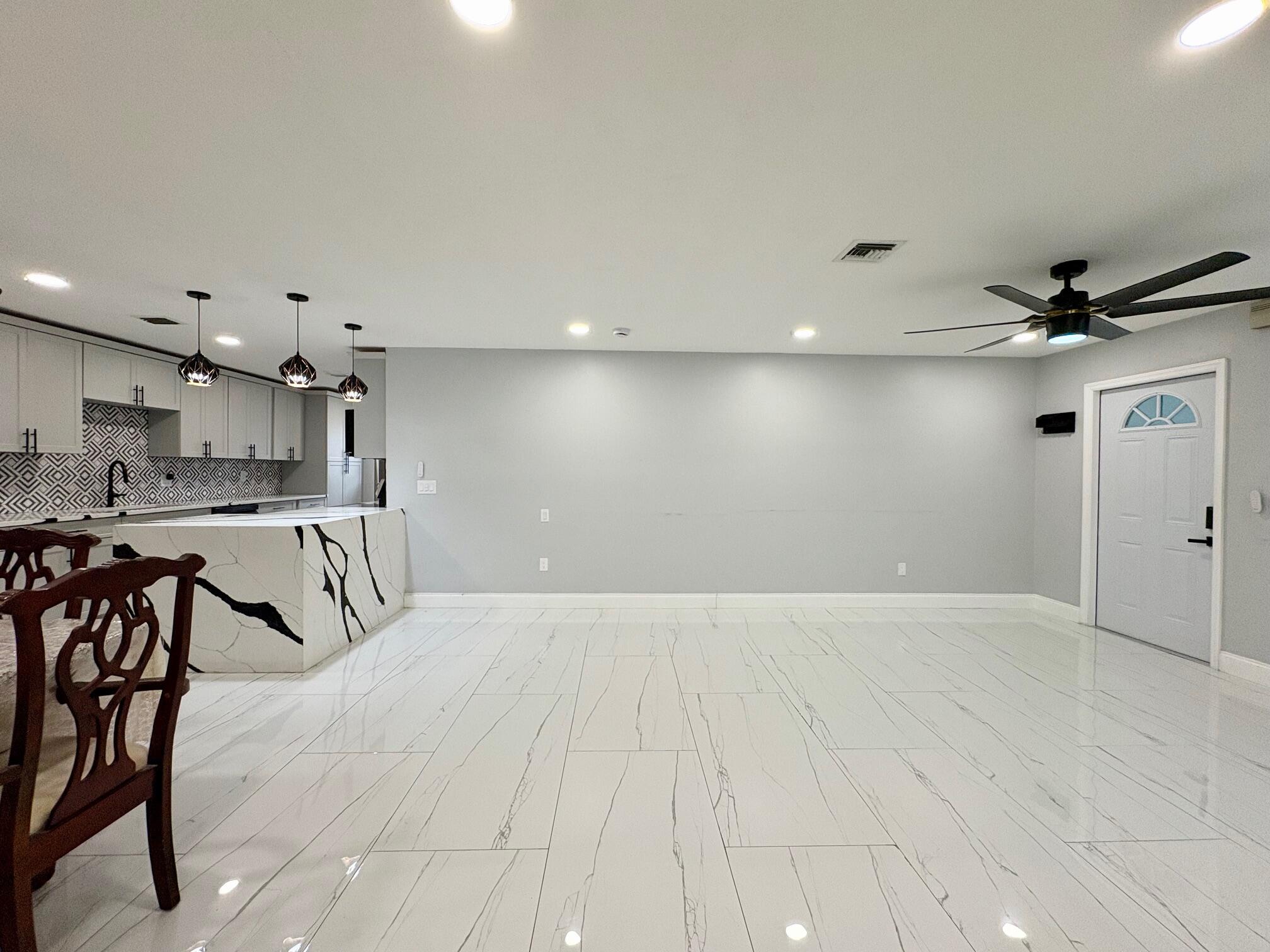 1733 Sunset Avenue Lake Worth Beach, FL 33460 - Photo 5 of 19 a view of a kitchen with a sink and cabinets