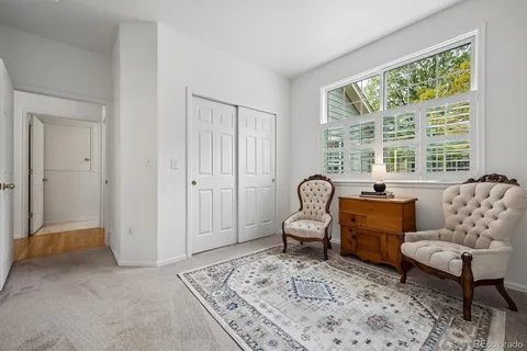 a living room with furniture and a rug