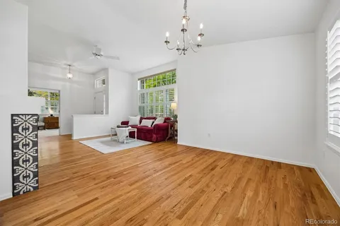 a view of a livingroom with furniture window and wooden floor
