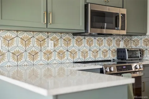 a kitchen with a microwave and a stove