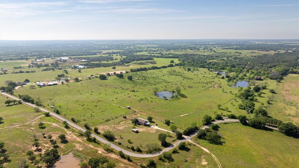 11701 Bowden Road Lipan, TX 76462 - Photo 4 of 26 an aerial view of ocean with residential building and ocean view