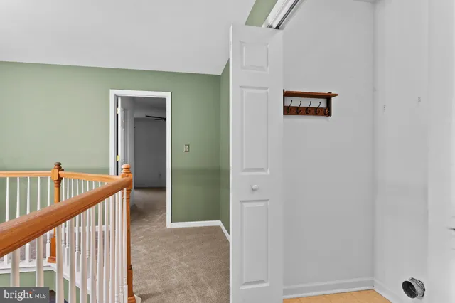 a view of a hallway with staircase