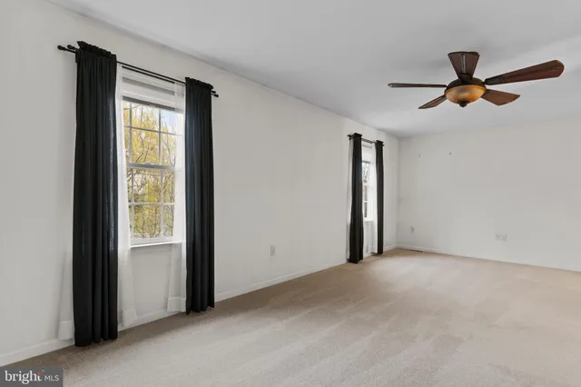 a view of empty room with windows