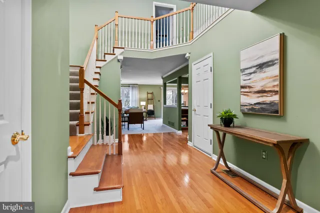 a view of front door with furniture and stairs